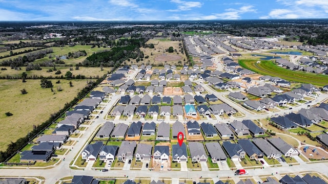 birds eye view of property with a residential view