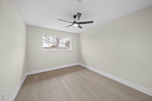 unfurnished room featuring ceiling fan and light hardwood / wood-style flooring