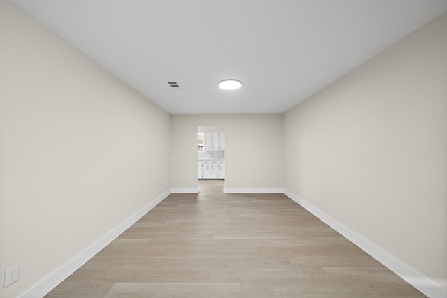 spare room featuring light wood-type flooring