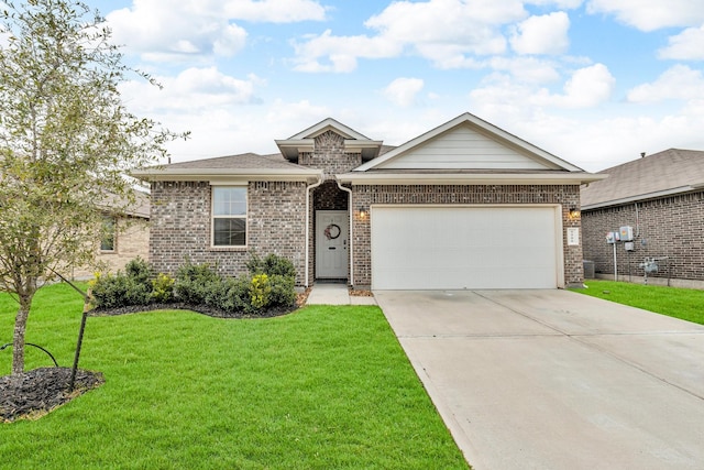 view of front of property with a front yard and a garage