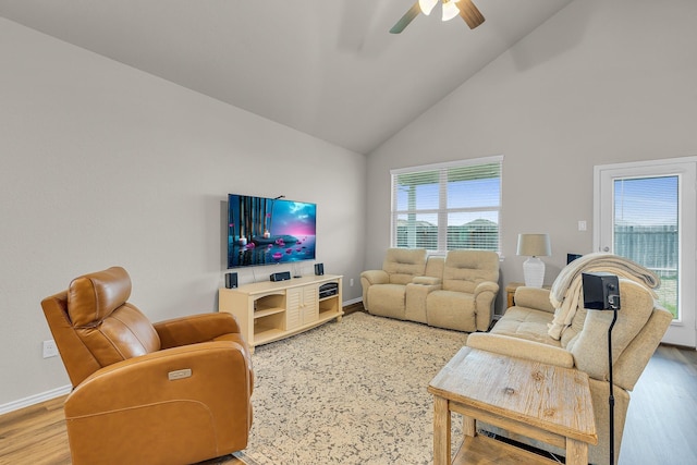 living room featuring wood-type flooring, high vaulted ceiling, and ceiling fan