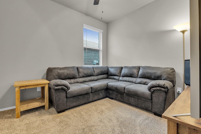 carpeted living room with vaulted ceiling and ceiling fan