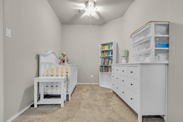 bedroom featuring light carpet and ceiling fan