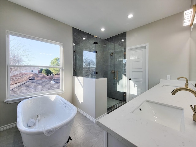 bathroom with vanity, tile patterned flooring, and separate shower and tub