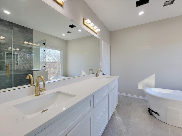 bathroom featuring vanity and shower with separate bathtub