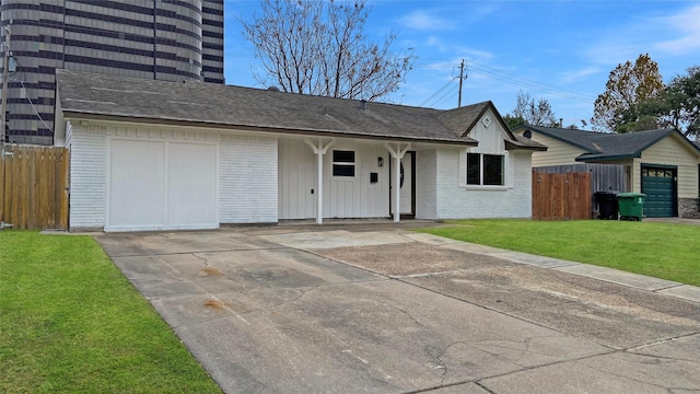 single story home featuring a garage and a front lawn