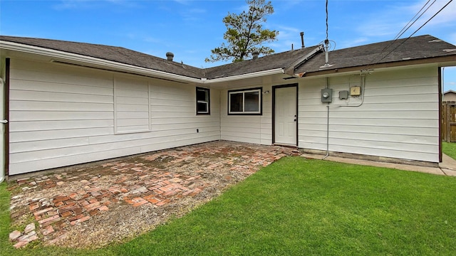 rear view of house with a lawn