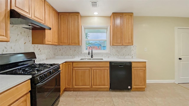 kitchen featuring sink, backsplash, light tile patterned floors, and black appliances