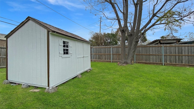 view of outbuilding with a yard