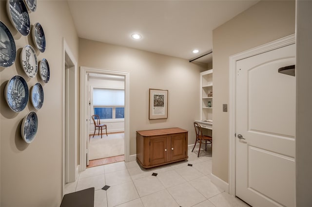 hallway with light tile patterned floors