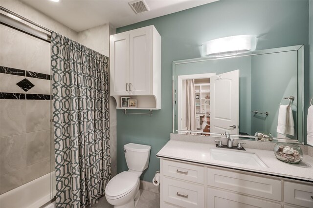 full bathroom featuring shower / bathtub combination with curtain, tile patterned floors, vanity, and toilet