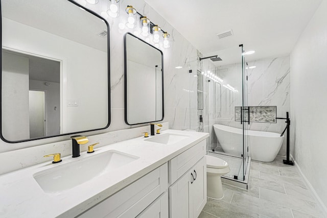 full bathroom featuring toilet, vanity, and separate shower and tub