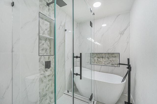 bathroom with separate shower and tub