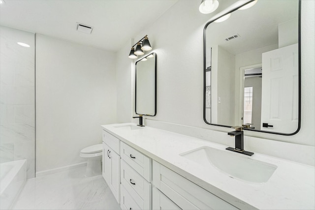 bathroom featuring vanity and toilet