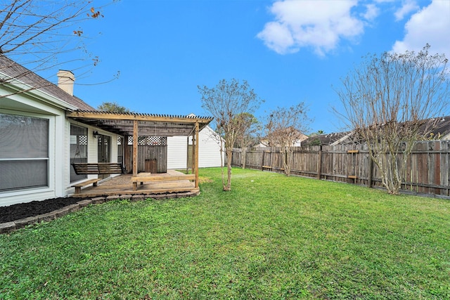 view of yard with a deck and a pergola