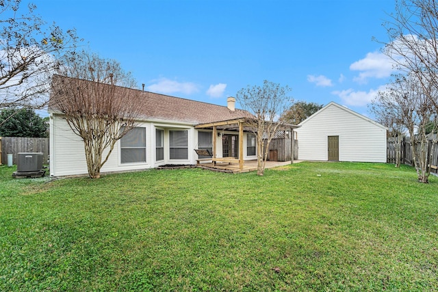 rear view of house featuring a patio, central air condition unit, a yard, and a pergola