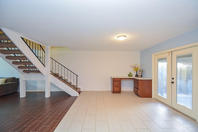 entrance foyer featuring french doors and light hardwood / wood-style flooring