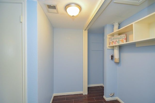 laundry area featuring dark wood-type flooring