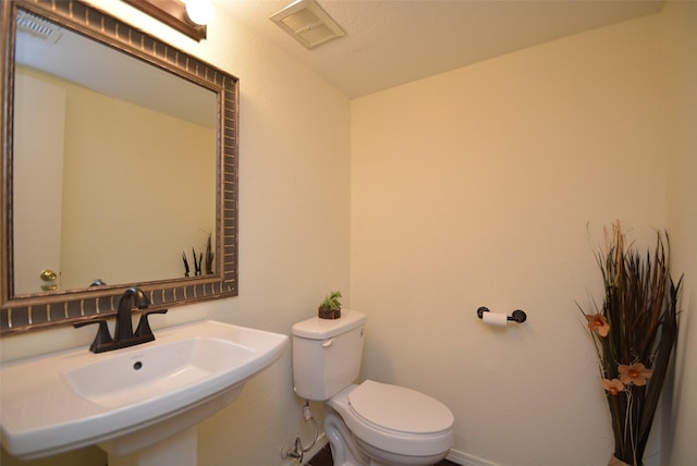 bathroom featuring sink and toilet