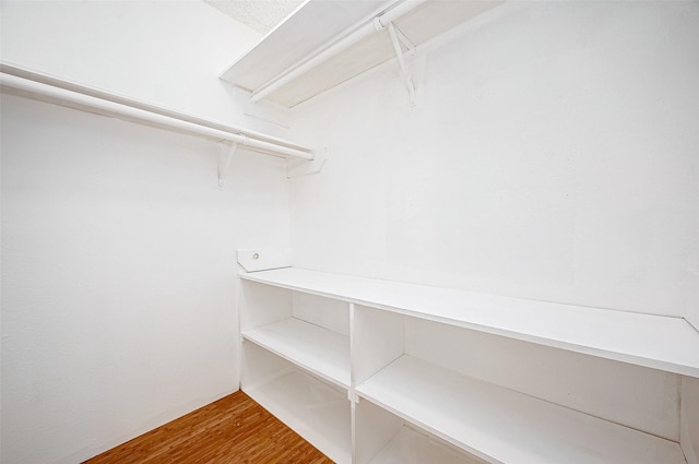 walk in closet featuring hardwood / wood-style floors