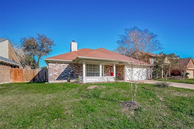 ranch-style home featuring a front lawn and a garage