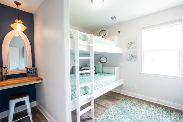 bedroom with wood-type flooring