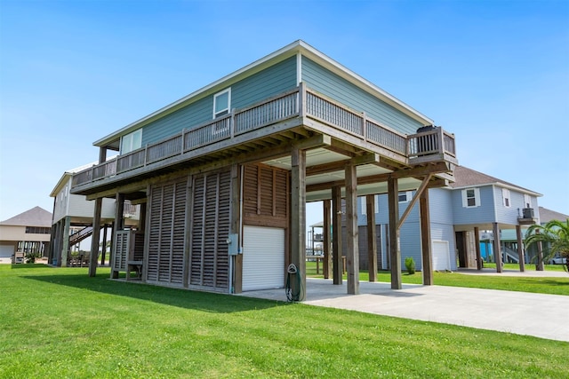 rear view of property with a yard and a carport