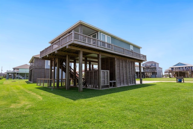 rear view of property with a yard