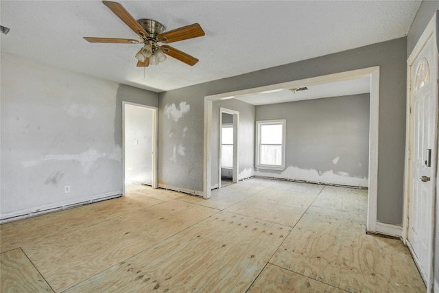 empty room featuring ceiling fan