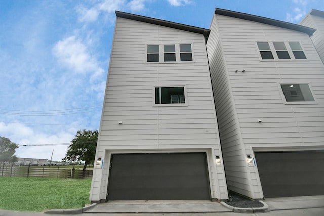 view of side of home featuring a garage