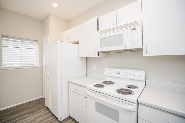 kitchen featuring white appliances, white cabinets, and dark wood-type flooring