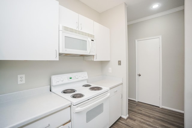 kitchen featuring white appliances, dark hardwood / wood-style flooring, white cabinetry, and crown molding