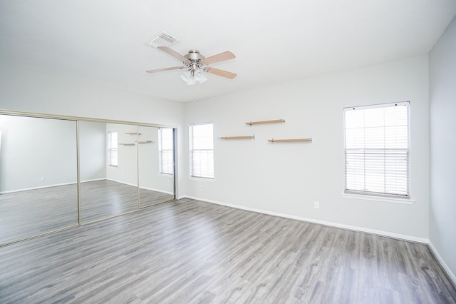 interior space featuring ceiling fan, light hardwood / wood-style floors, and plenty of natural light