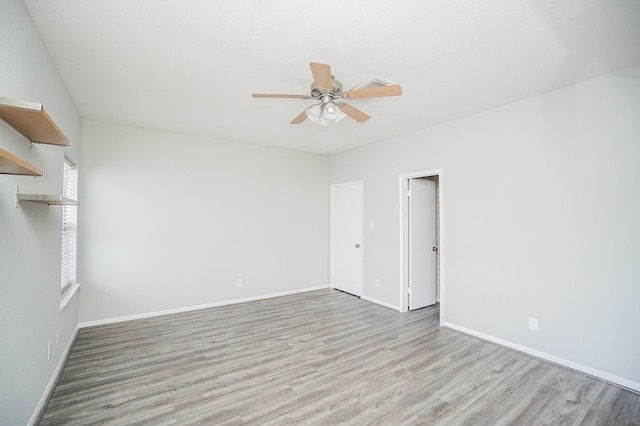 unfurnished room featuring ceiling fan and light hardwood / wood-style flooring