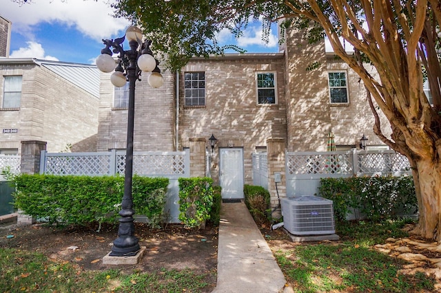 view of front of property featuring central air condition unit