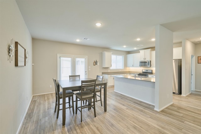 dining area featuring light hardwood / wood-style floors