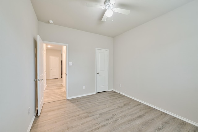 unfurnished bedroom featuring ceiling fan and light hardwood / wood-style floors