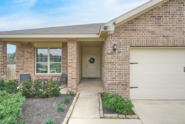 view of exterior entry featuring a garage