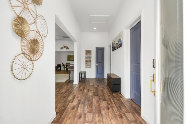 hallway with dark hardwood / wood-style flooring