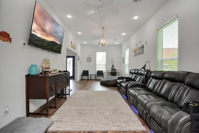 living room with ceiling fan and hardwood / wood-style flooring