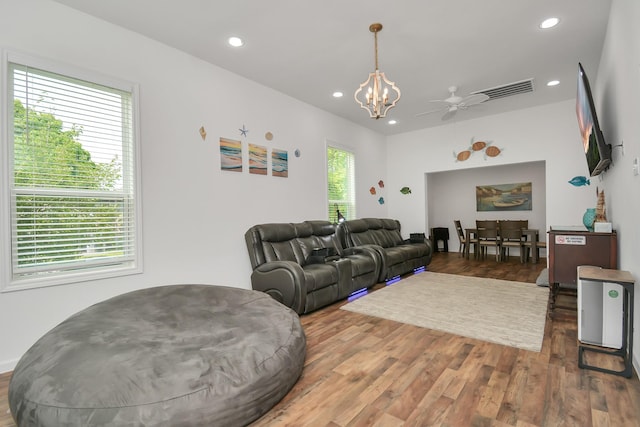 living room with ceiling fan and dark hardwood / wood-style floors