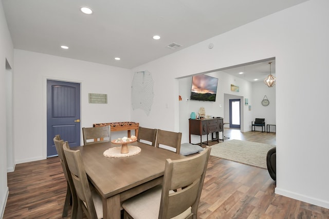 dining area with dark wood-type flooring