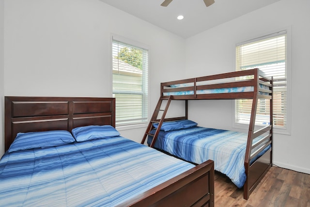 bedroom featuring ceiling fan and dark hardwood / wood-style flooring