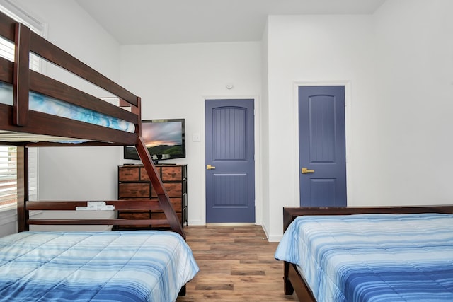 bedroom with wood-type flooring