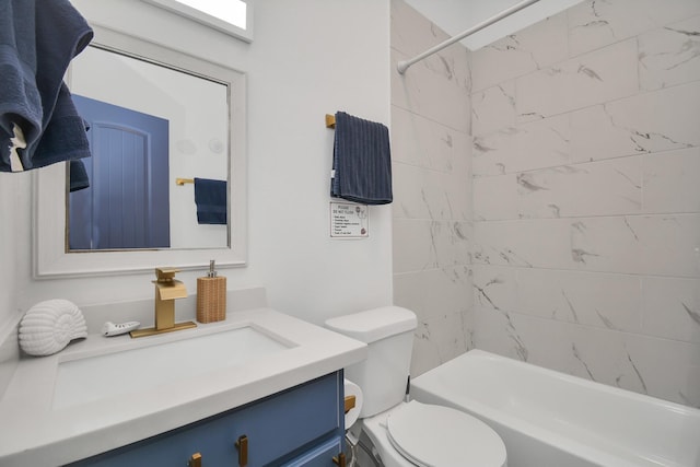 full bathroom featuring toilet, vanity, and tiled shower / bath