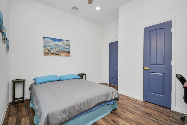 bedroom featuring ceiling fan and dark hardwood / wood-style floors