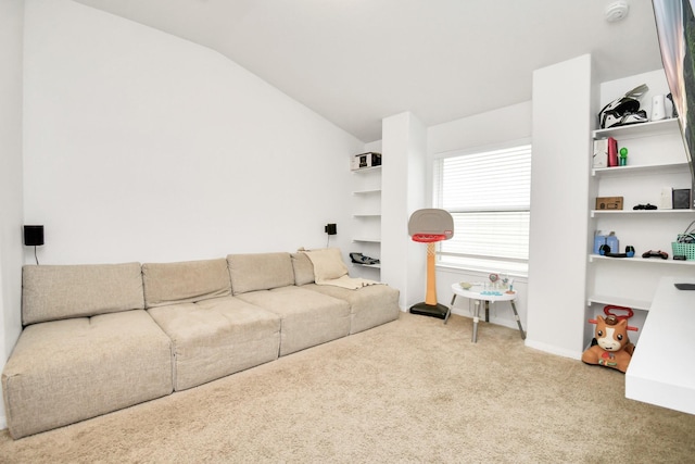 living room with lofted ceiling and carpet