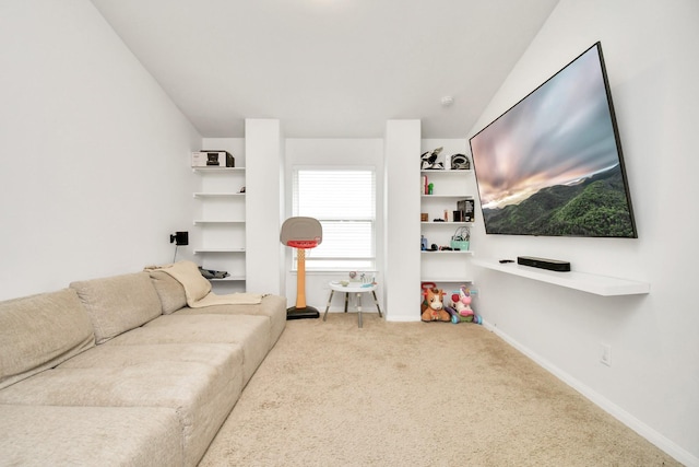 living room featuring light colored carpet and vaulted ceiling