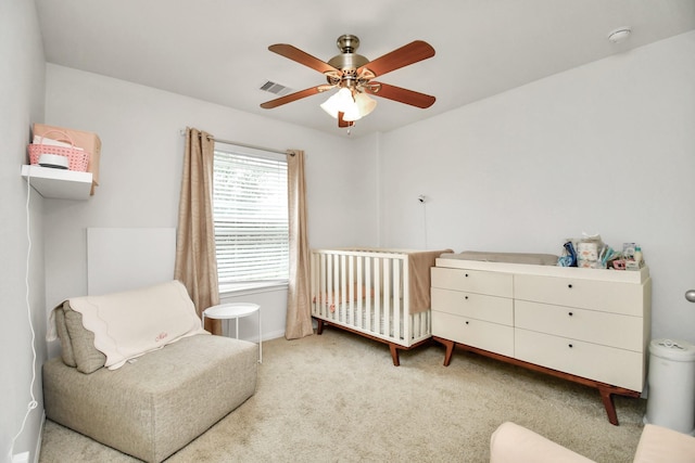 carpeted bedroom featuring ceiling fan