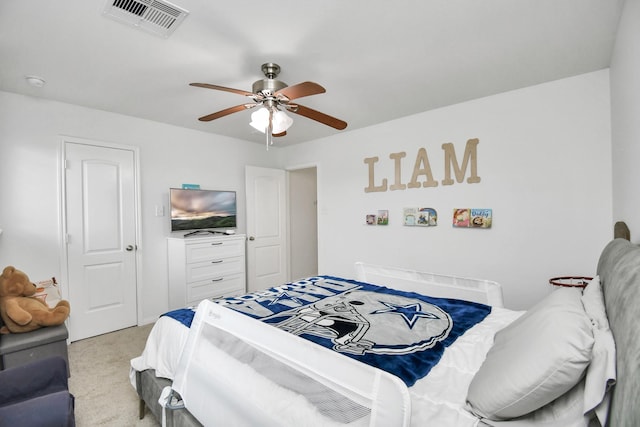 bedroom featuring light colored carpet and ceiling fan